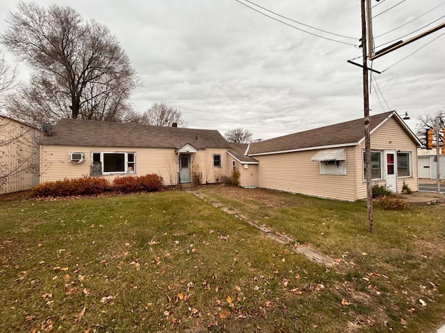 back of house featuring a yard