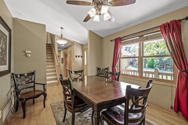 2567 Bridle Creek Trl, Chanhassen, MN 55317 - dining space with stairs, vaulted ceiling, light wood-style floors, and ceiling fan