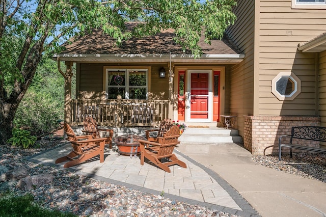 2567 Bridle Creek Trl, Chanhassen, MN 55317 - view of exterior entry featuring covered porch and roof with shingles