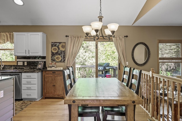 2567 Bridle Creek Trl, Chanhassen, MN 55317 - dining room with a chandelier and light wood-type flooring