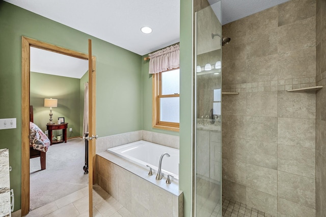 2567 Bridle Creek Trl, Chanhassen, MN 55317 - bathroom with ensuite bath, a stall shower, a bath, and tile patterned flooring