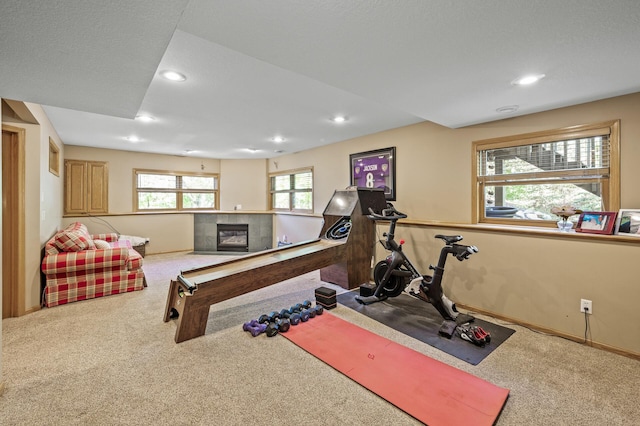 2567 Bridle Creek Trl, Chanhassen, MN 55317 - workout room with carpet flooring, a fireplace, and recessed lighting