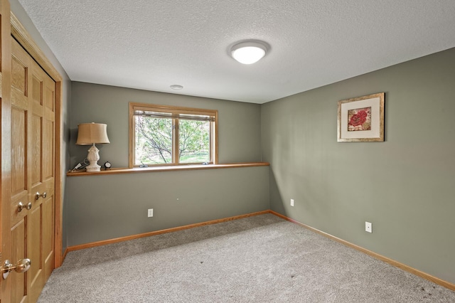 2567 Bridle Creek Trl, Chanhassen, MN 55317 - carpeted spare room featuring a textured ceiling