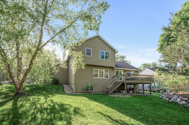 2567 Bridle Creek Trl, Chanhassen, MN 55317 - back of house with stairway, a wooden deck, and a yard