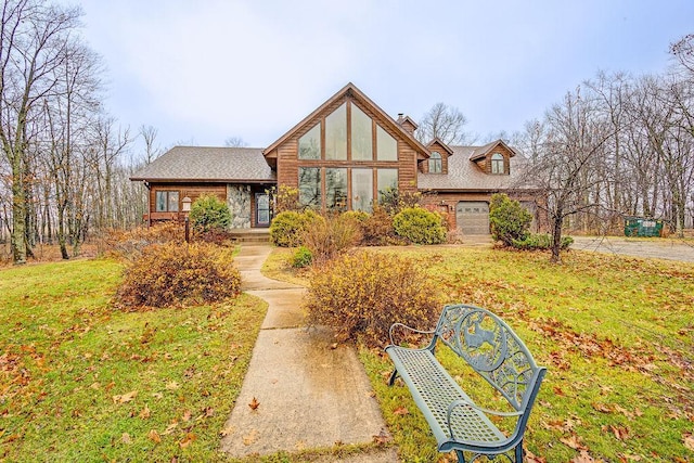 view of front of house featuring a front lawn and a garage