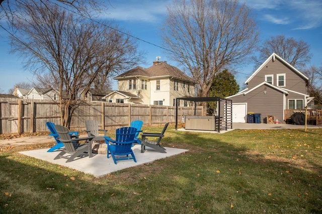 view of yard featuring a patio, an outdoor fire pit, and a hot tub