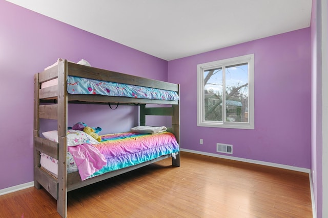 bedroom with wood-type flooring