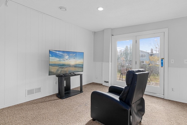 sitting room featuring carpet flooring