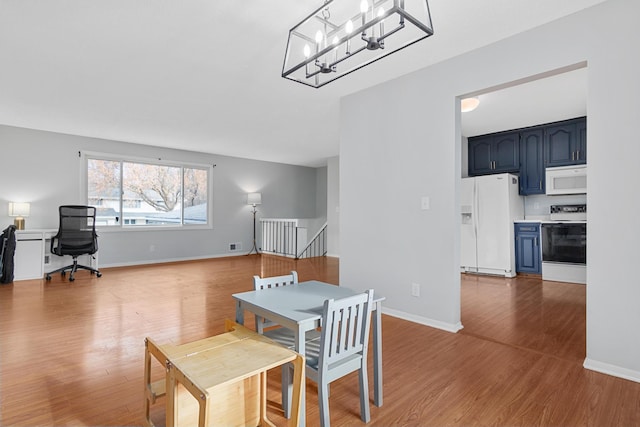 dining area with light wood-type flooring