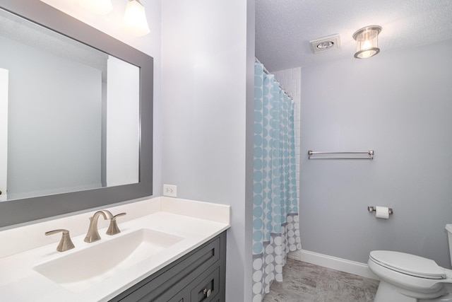 bathroom with a shower with shower curtain, vanity, a textured ceiling, tile patterned flooring, and toilet