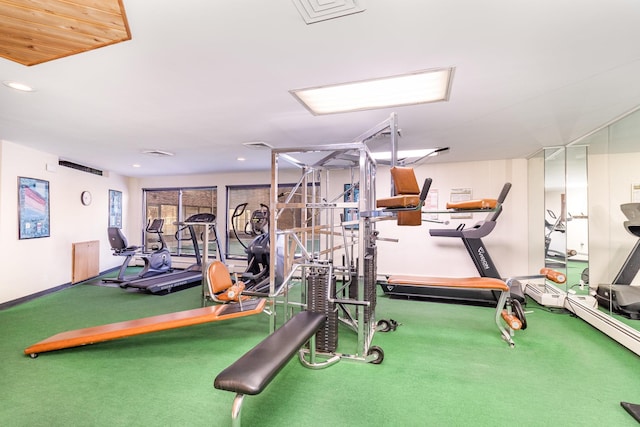 exercise room featuring carpet flooring and recessed lighting