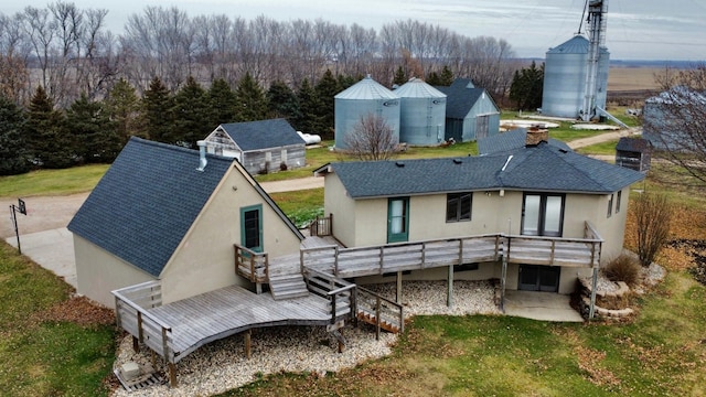 rear view of house with a yard, a patio area, and a wooden deck