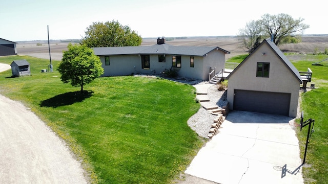 64345 370th St, Ortonville, MN 56278 - view of front facade with stucco siding, a front lawn, driveway, and an attached garage