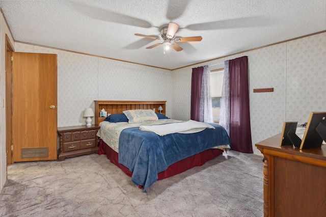 carpeted bedroom featuring ceiling fan, crown molding, and a textured ceiling