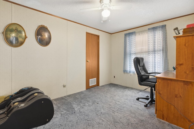 office area with carpet flooring, ceiling fan, and a textured ceiling