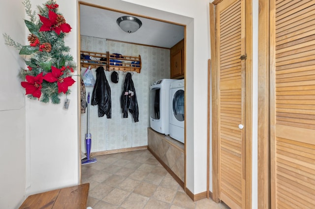 laundry area featuring cabinets and washer and clothes dryer