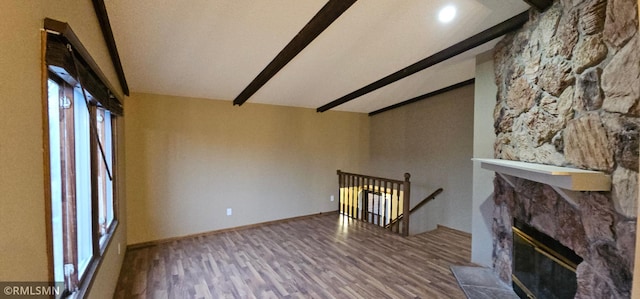 9725 Thomas Ave N, Brooklyn Park, MN 55444 - unfurnished living room featuring wood finished floors and a fireplace