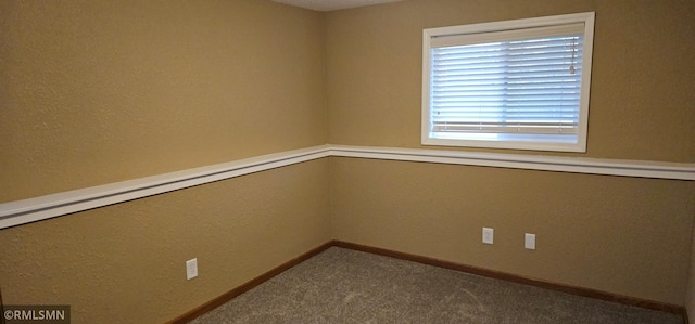 9725 Thomas Ave N, Brooklyn Park, MN 55444 - carpeted spare room featuring baseboards and a textured wall