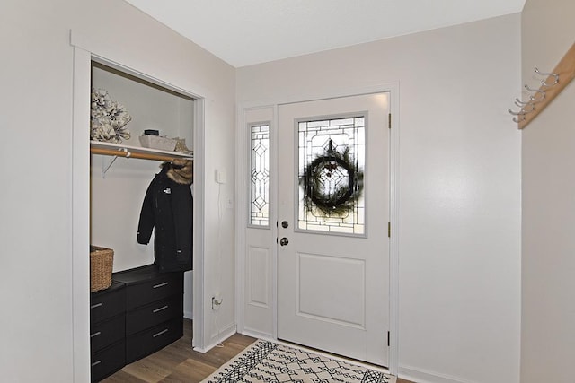 entryway with wood finished floors