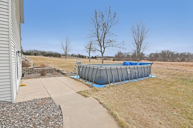 view of yard with an outdoor pool