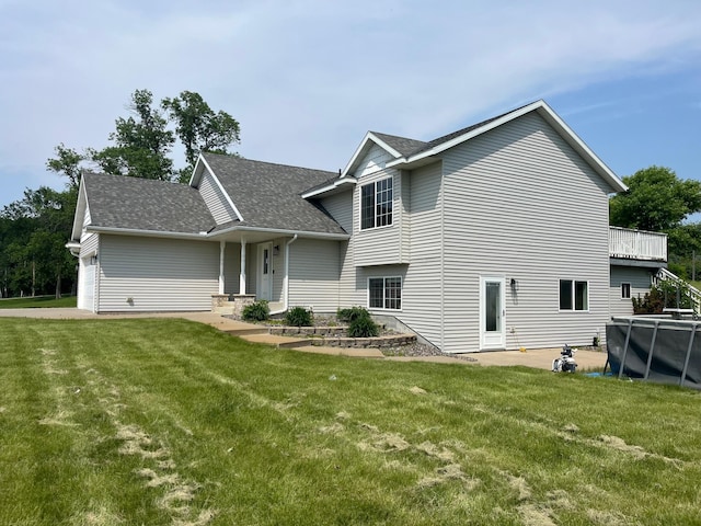 35684 219th Ave, Albany, MN 56307 - view of front of home featuring a front yard, roof with shingles, and an attached garage