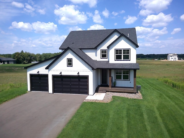 modern farmhouse with covered porch, a front yard, and a garage