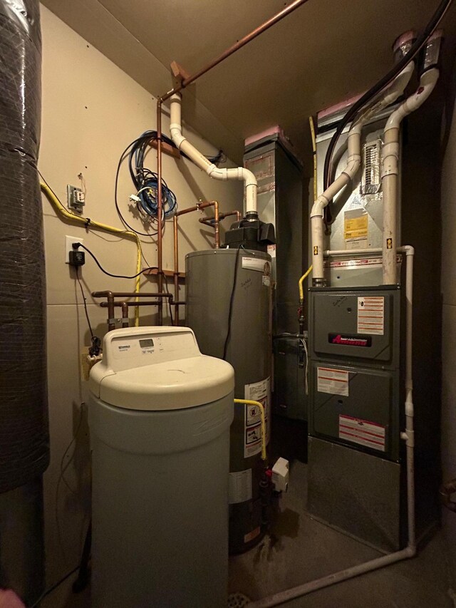 utility room featuring gas water heater