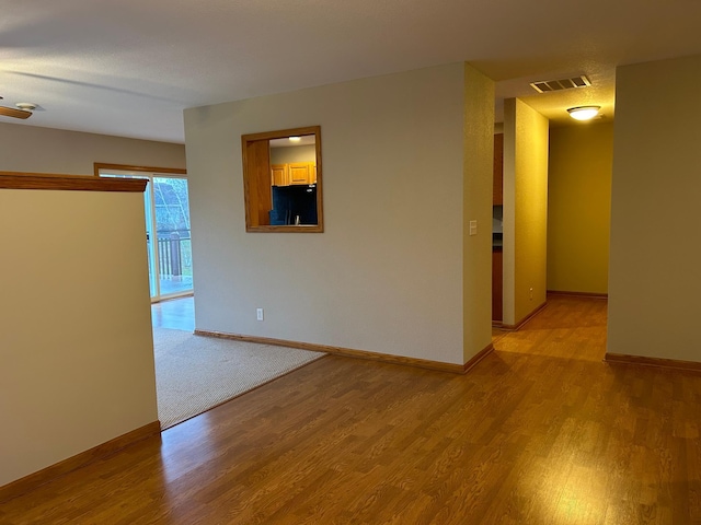 spare room with light hardwood / wood-style floors