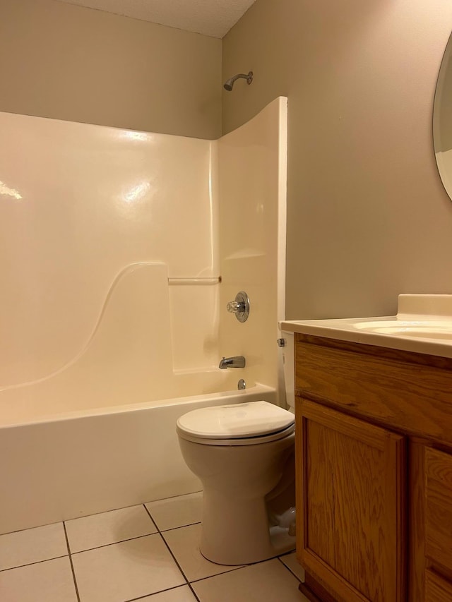 full bathroom featuring shower / bathing tub combination, tile patterned flooring, vanity, and toilet