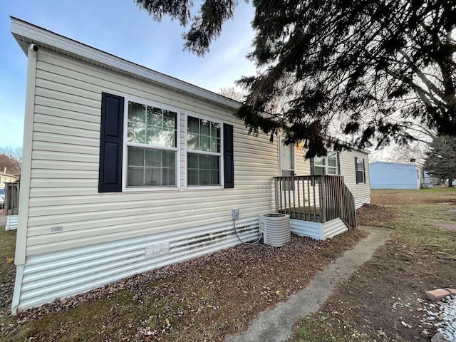 view of side of property featuring cooling unit