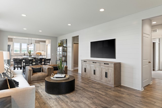 living room with dark hardwood / wood-style floors