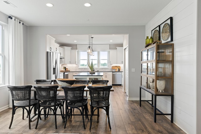 dining area featuring dark wood-type flooring