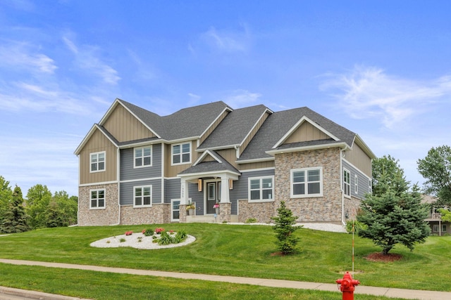 craftsman inspired home with a front lawn