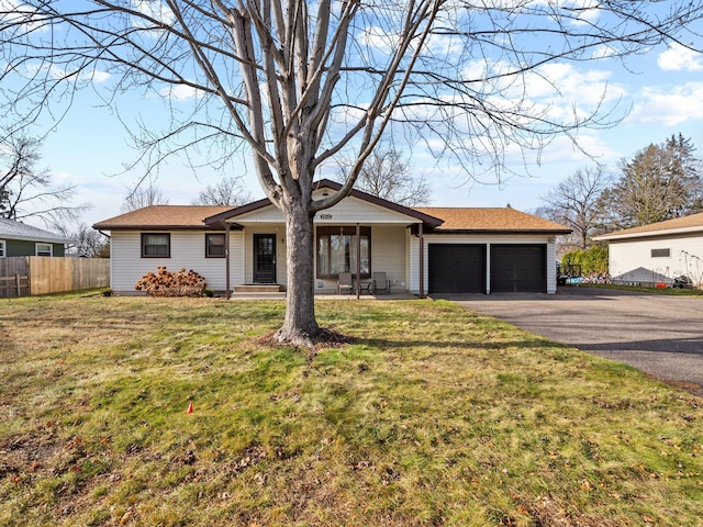 ranch-style home with a front yard, a porch, and a garage