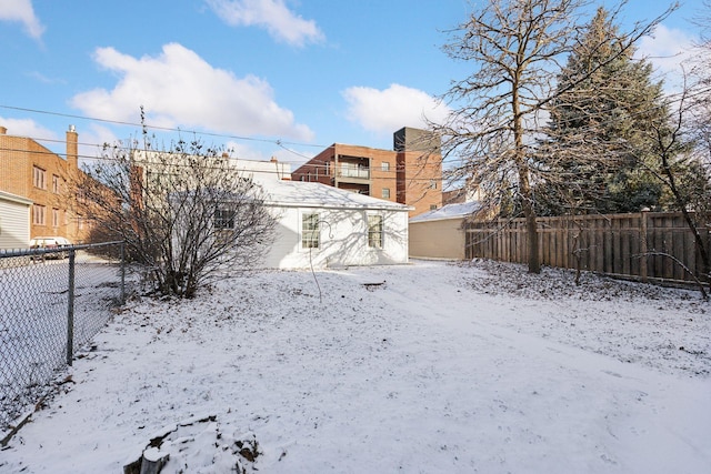 view of yard layered in snow