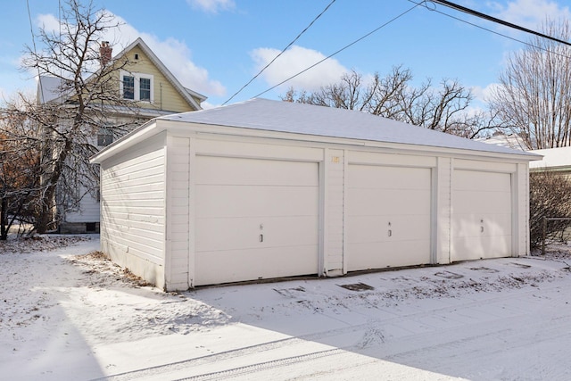 view of snow covered garage