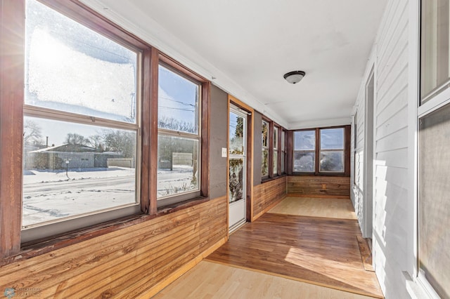 unfurnished sunroom featuring plenty of natural light