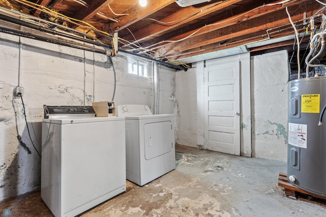 laundry room with separate washer and dryer and water heater