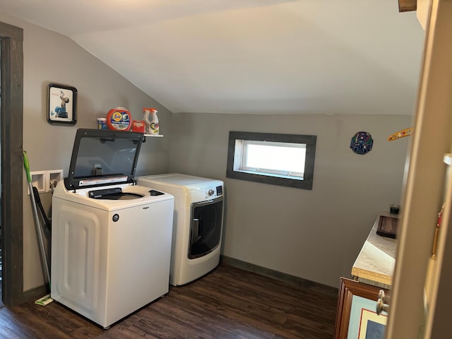 laundry room with dark hardwood / wood-style flooring and washing machine and dryer