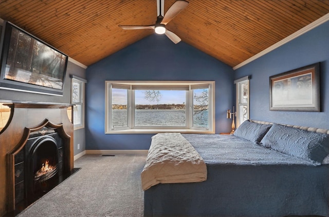 carpeted bedroom featuring wood ceiling, baseboards, a lit fireplace, and vaulted ceiling