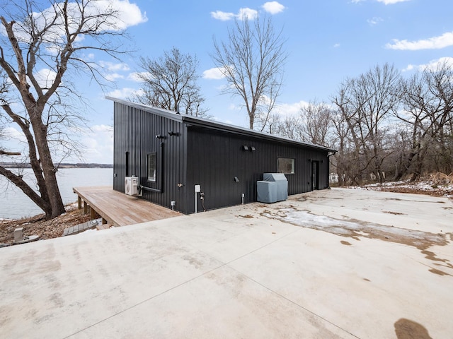 snow covered property featuring a water view