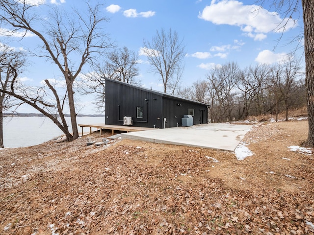 back of house with a water view