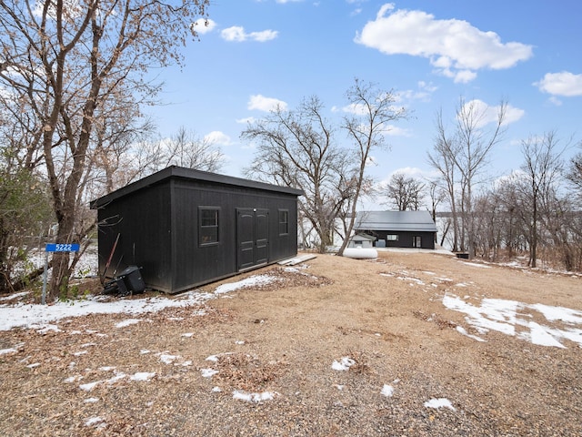 exterior space with a storage shed