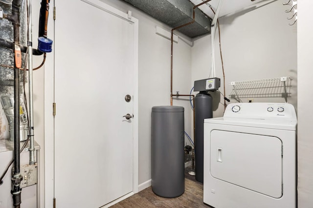 laundry area with washing machine and dryer and dark hardwood / wood-style flooring