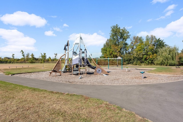 view of playground featuring a lawn