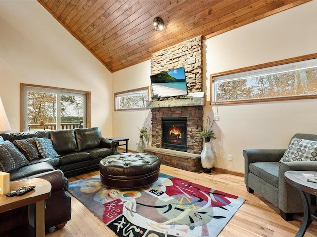 living room with a stone fireplace, high vaulted ceiling, wooden ceiling, and light wood-type flooring