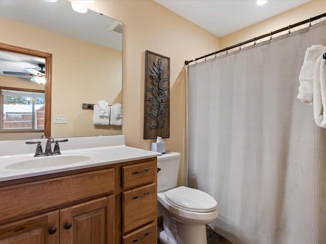 bathroom with ceiling fan, vanity, and toilet