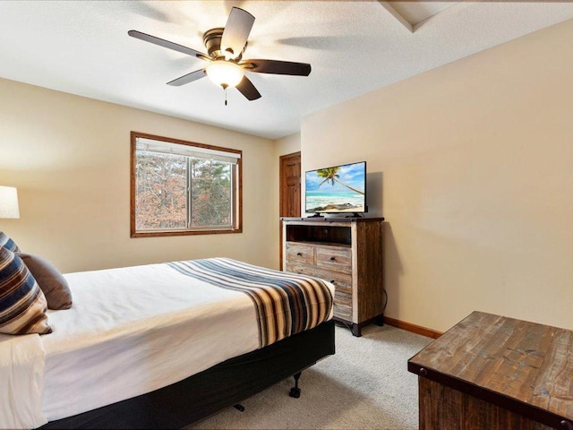 bedroom with ceiling fan and light carpet