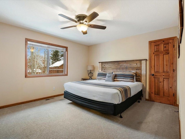 bedroom with ceiling fan and carpet floors