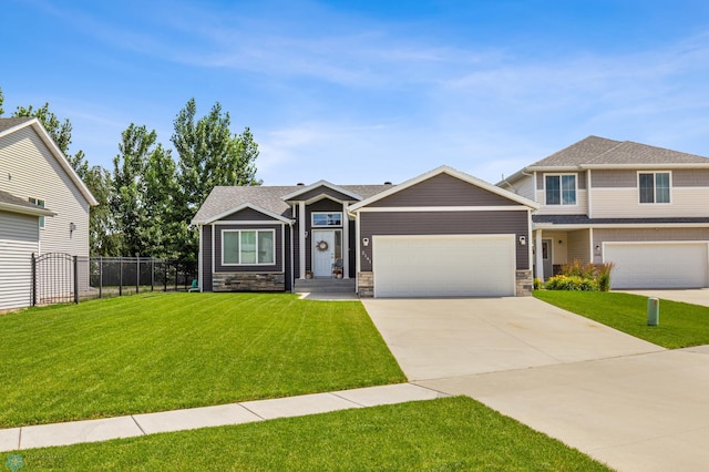 view of front of property with a garage and a front lawn